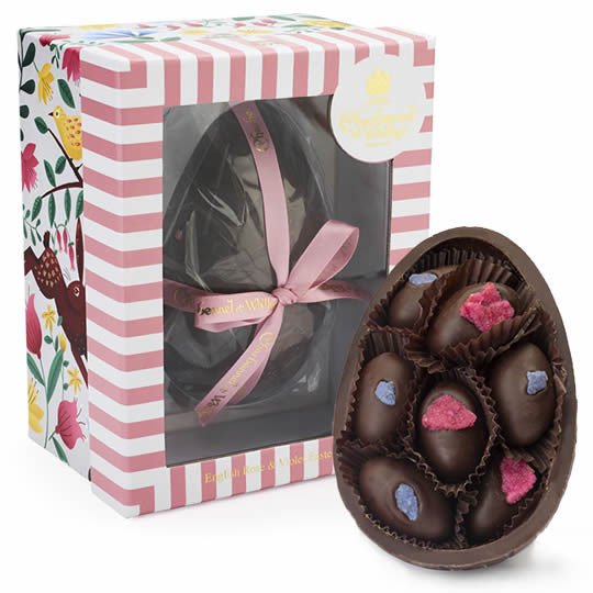 Buy Charbonnel et Walker English Rose & Violet Dark Chocolate Easter Egg 225g from choctrade Charbonnel et Walker English Rose & Violet Dark Chocolate Easter Egg 225g, boxed and half an egg showing the chocolates inside.