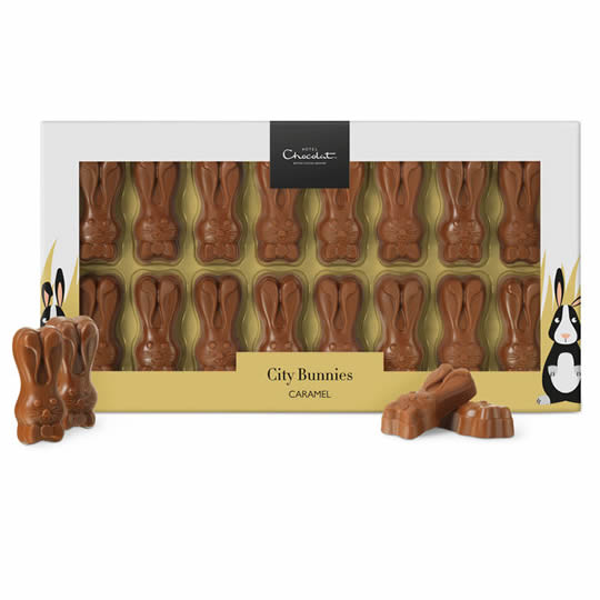 A box of Hotel Chocolat Caramel Chocolate Bunnies, with bunnies outside the box.
