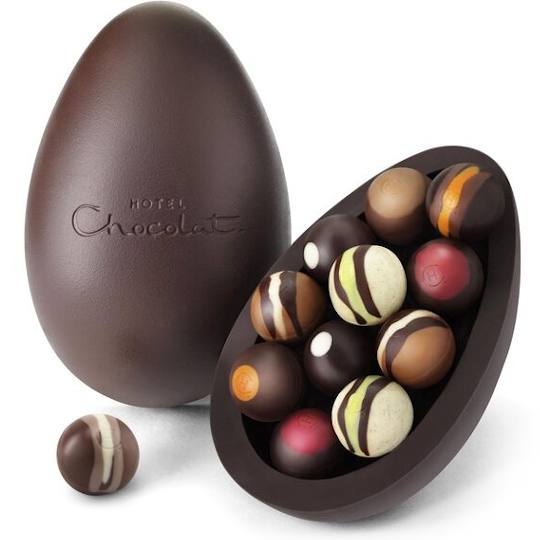 Hotel Chocolat Chocolate Truffles Extra Thick Easter Egg, Two chocolate shells with the chocolates in display.