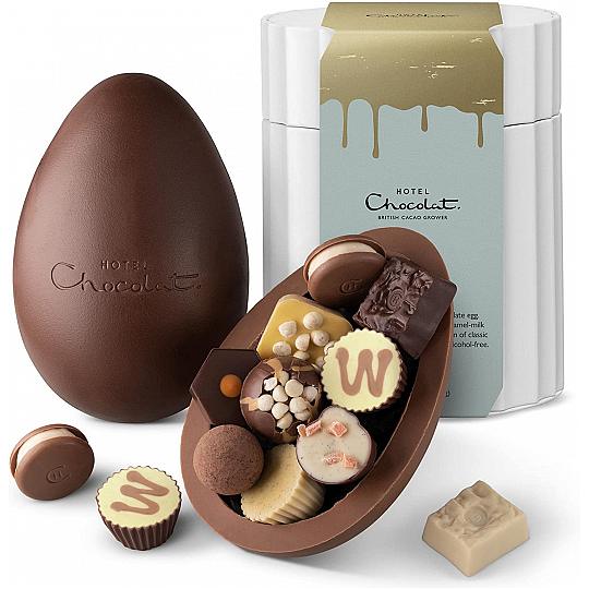 Hotel Chocolat Patisserie Chocolate Extra Thick Easter Egg, dark and milk chocolate shell with chocolates on display.